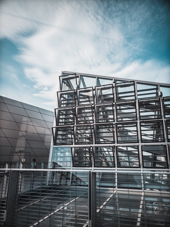 grey-concrete-building-with-multiple-windows